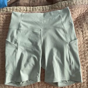 White Fabletics biker shorts with pockets